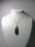 Eudialyte Cabochon Pendant Wire Wrapped .925 Sterling Silver display - Jemel