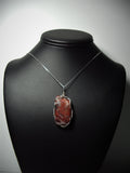 Red White and Black Agate Pendant Wire Wrapped .925 Sterling Silver display - Jemel