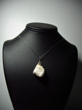 Raw Scolecite Crystal Pendant Wire Wrapped .925 Sterling Silver display - Jemel